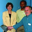 Wolfgang Ziegenhagen, Techno-Plastics, clocking in on the Accsys Biometric access pad while Teryl Schroenn, Accsys, and Musa Malinga, Techno-Plastics, look on